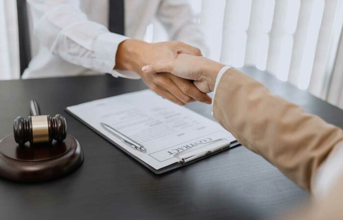 Lawyer shaking hands for blog post - Do I need a personal injury lawyer
