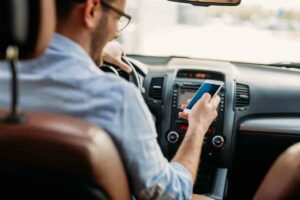 Distracted drivers using cell phone while driving