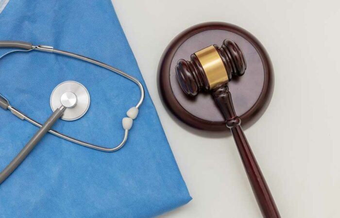 Personal injury cases illustration showing stethoscope and gavel